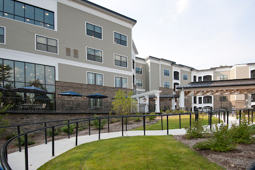 A modern residential apartment complex featuring landscaped grounds and a welcoming environment.