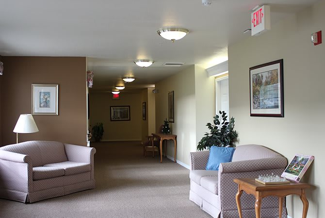 A quiet hallway with sofas and decorative elements.