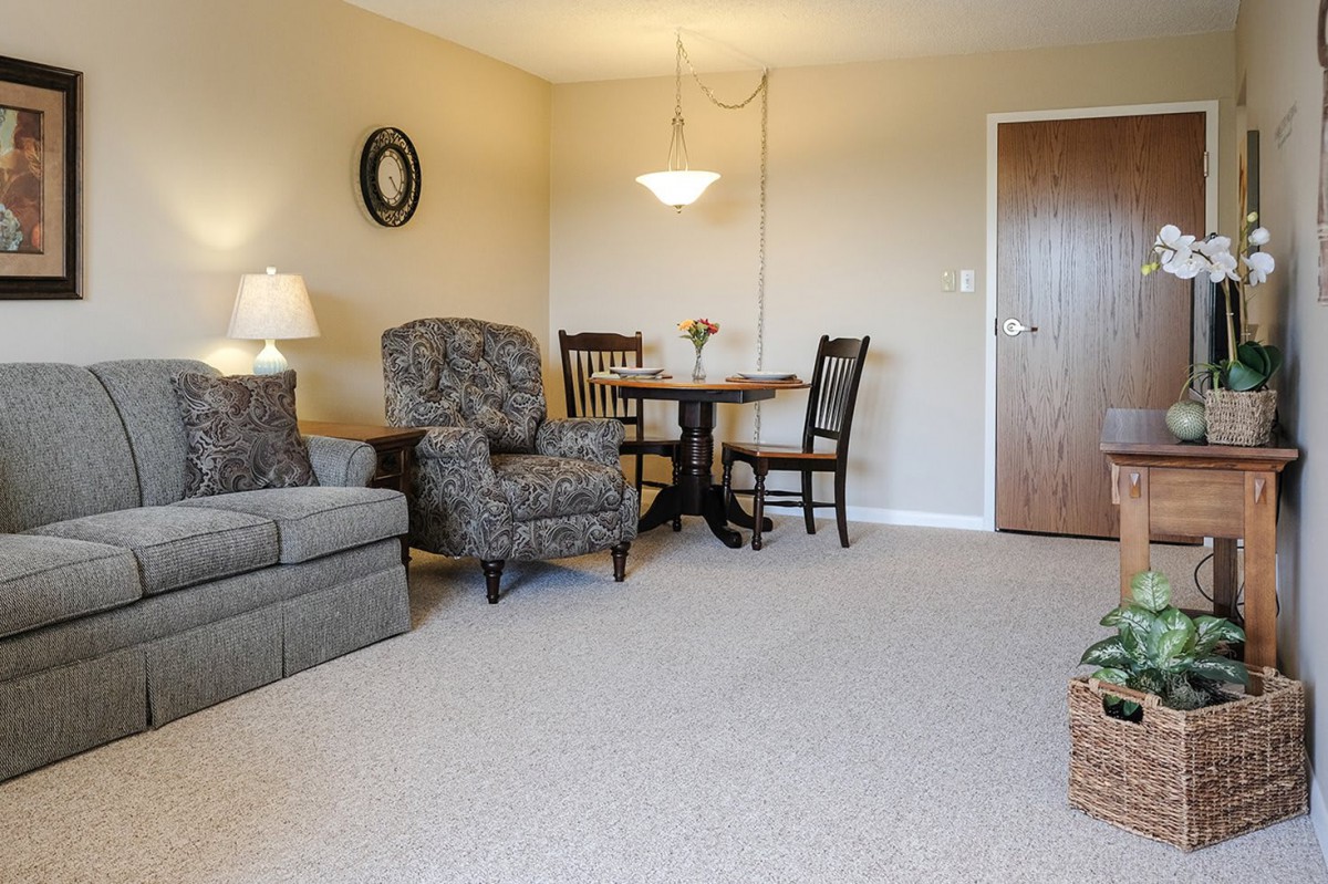 A cozy living room featuring comfortable furniture and warm lighting.