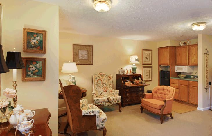 A cozy living room with traditional furniture and warm lighting.