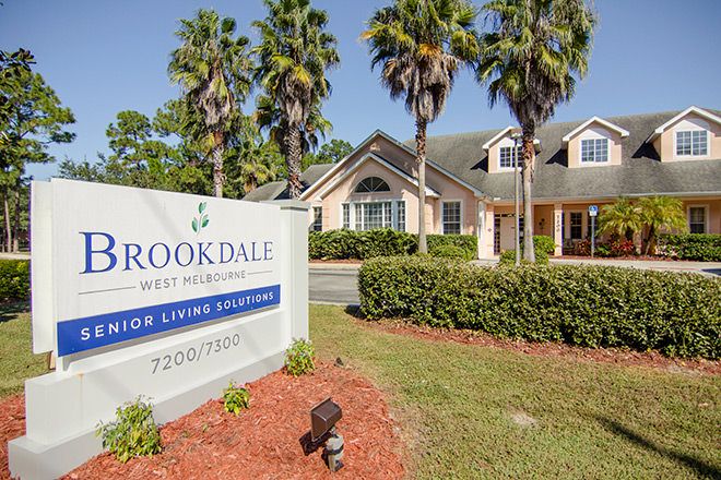 A senior living community with a welcoming entrance and well-maintained landscaping.