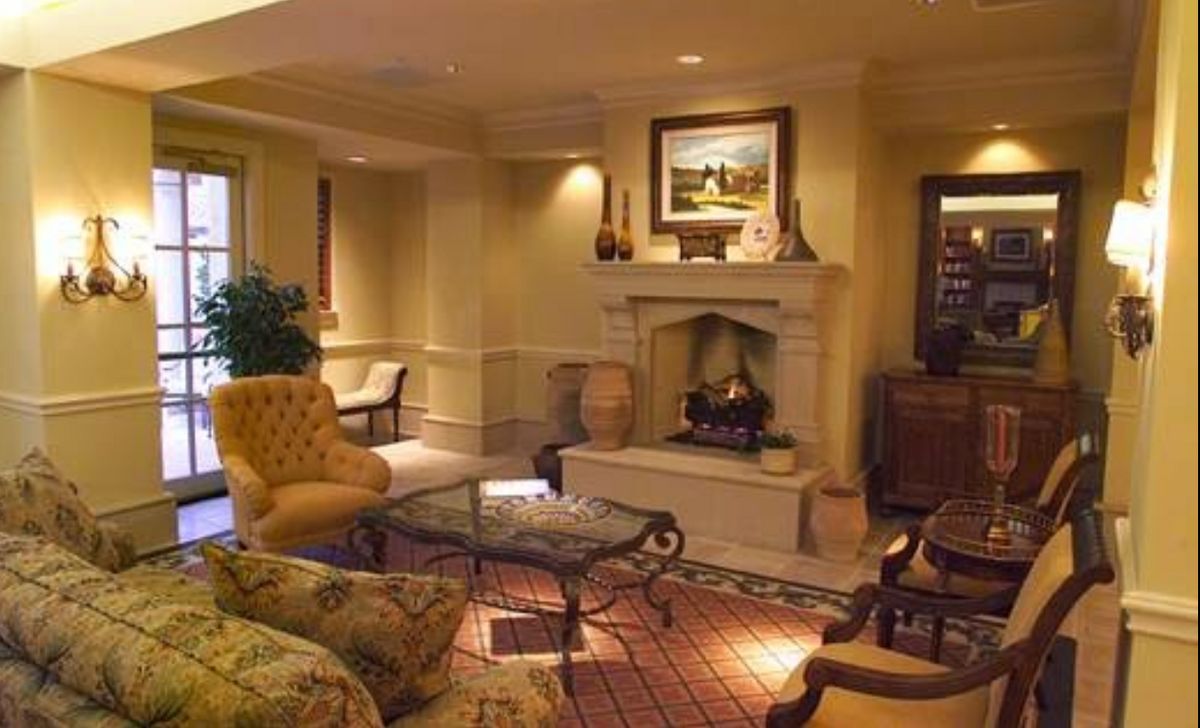 A cozy living room with elegant furniture and a fireplace.