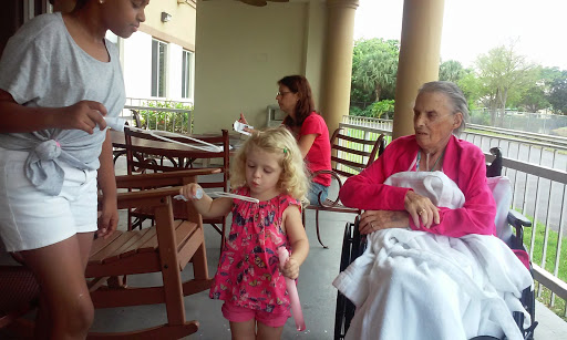 A heartwarming moment captured with a little girl enjoying her time with family.