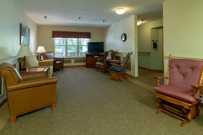 A cozy living room with comfortable seating and a television.