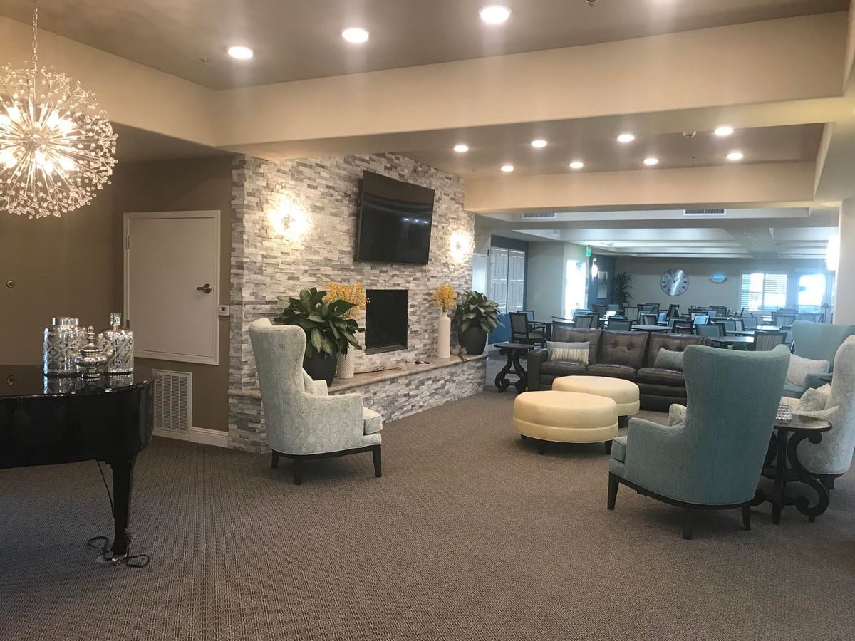 A modern lobby seating area with comfortable furniture and warm lighting.