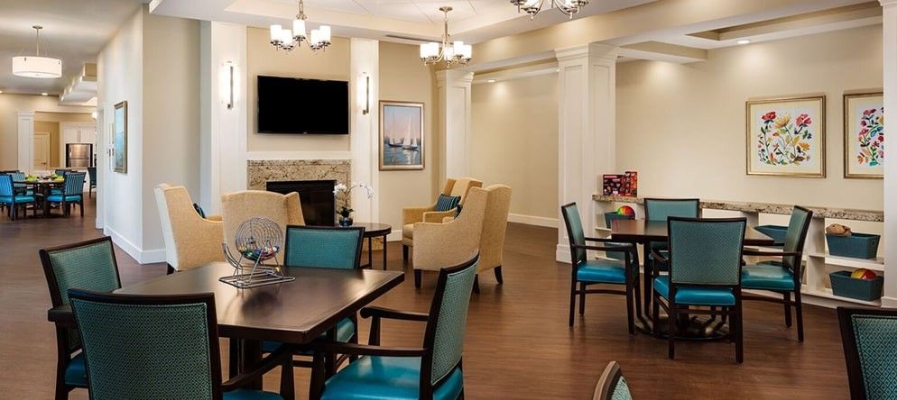 A cozy living room with a fireplace, television, and comfortable seating.