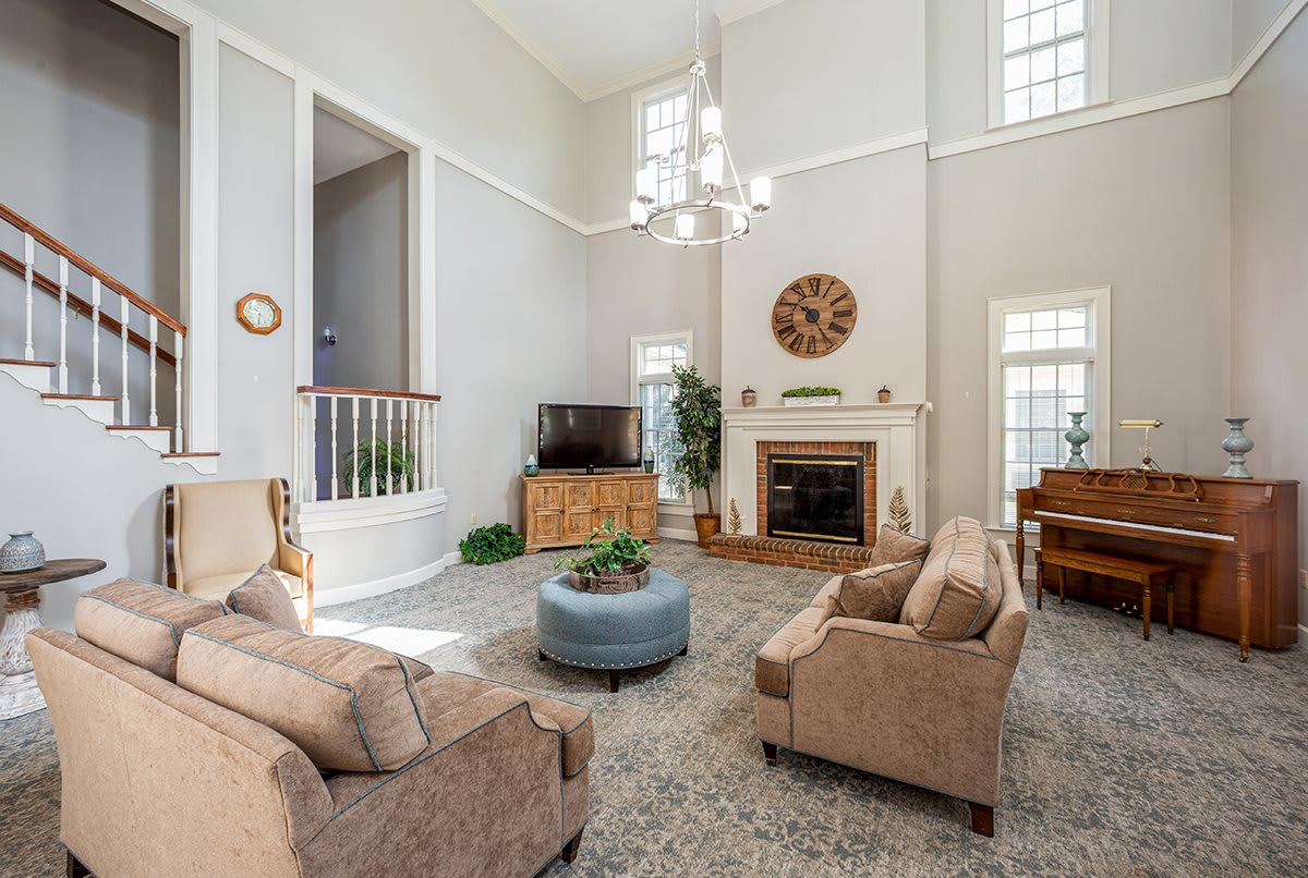 A spacious living room with comfortable seating and elegant decor.