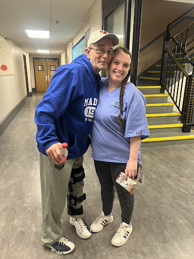 A memorable moment shared between two friends in a hallway.