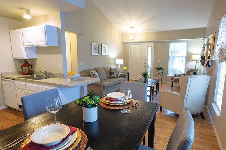 A modern open-concept living and dining area in an apartment.