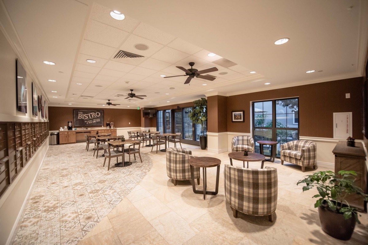 A modern cafe with ample seating and stylish interior design.