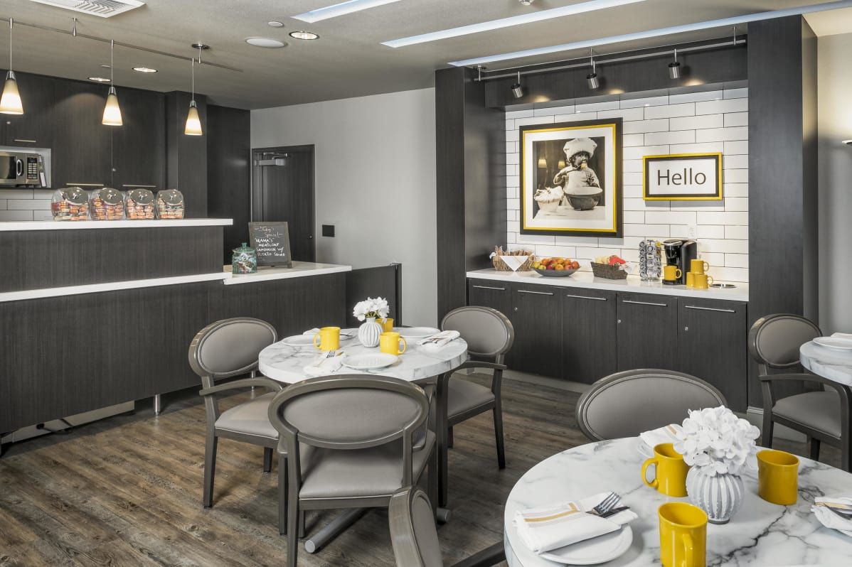 A modern cafe interior featuring a cozy dining area with contemporary decor.