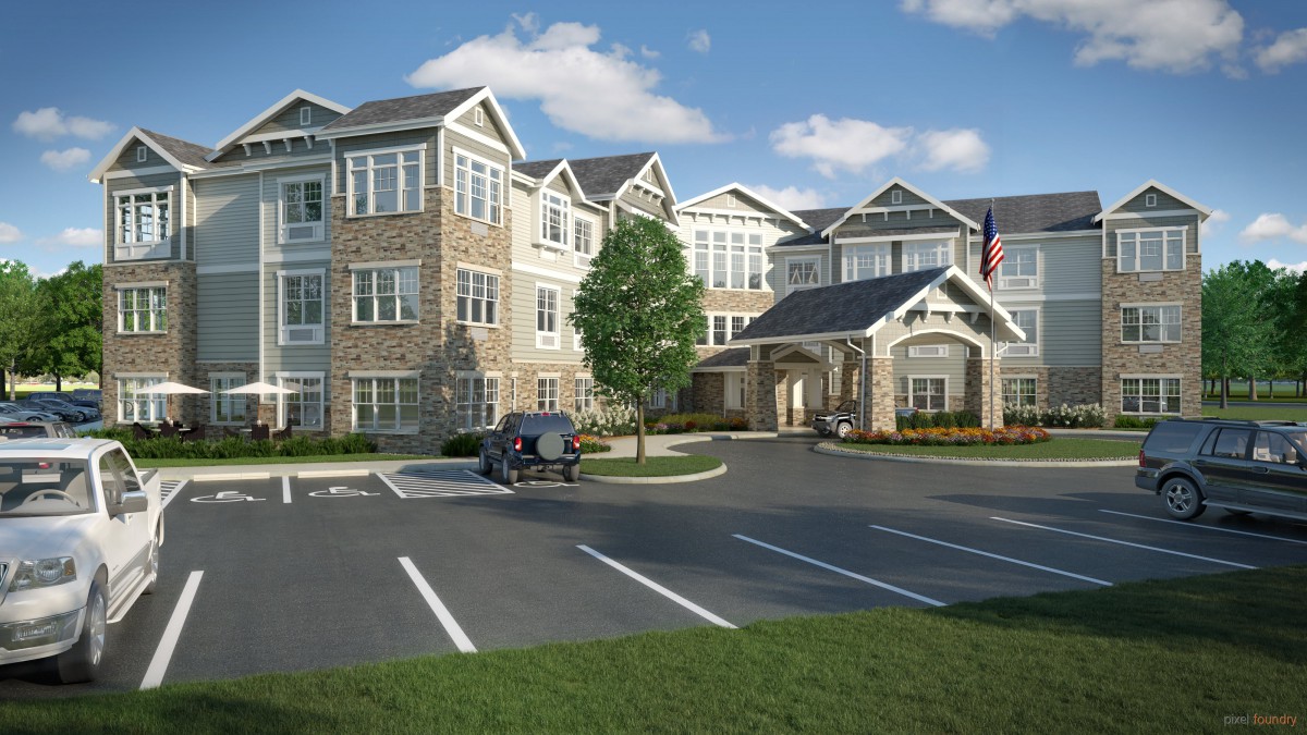 A modern residential building with a parking lot in front, surrounded by landscaping and a clear blue sky.