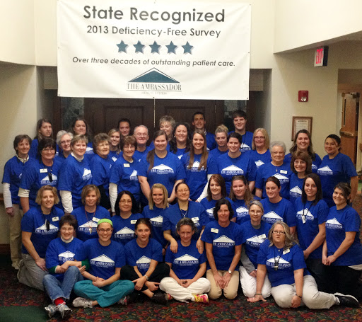 A dedicated team celebrating their recognition with a group photo.