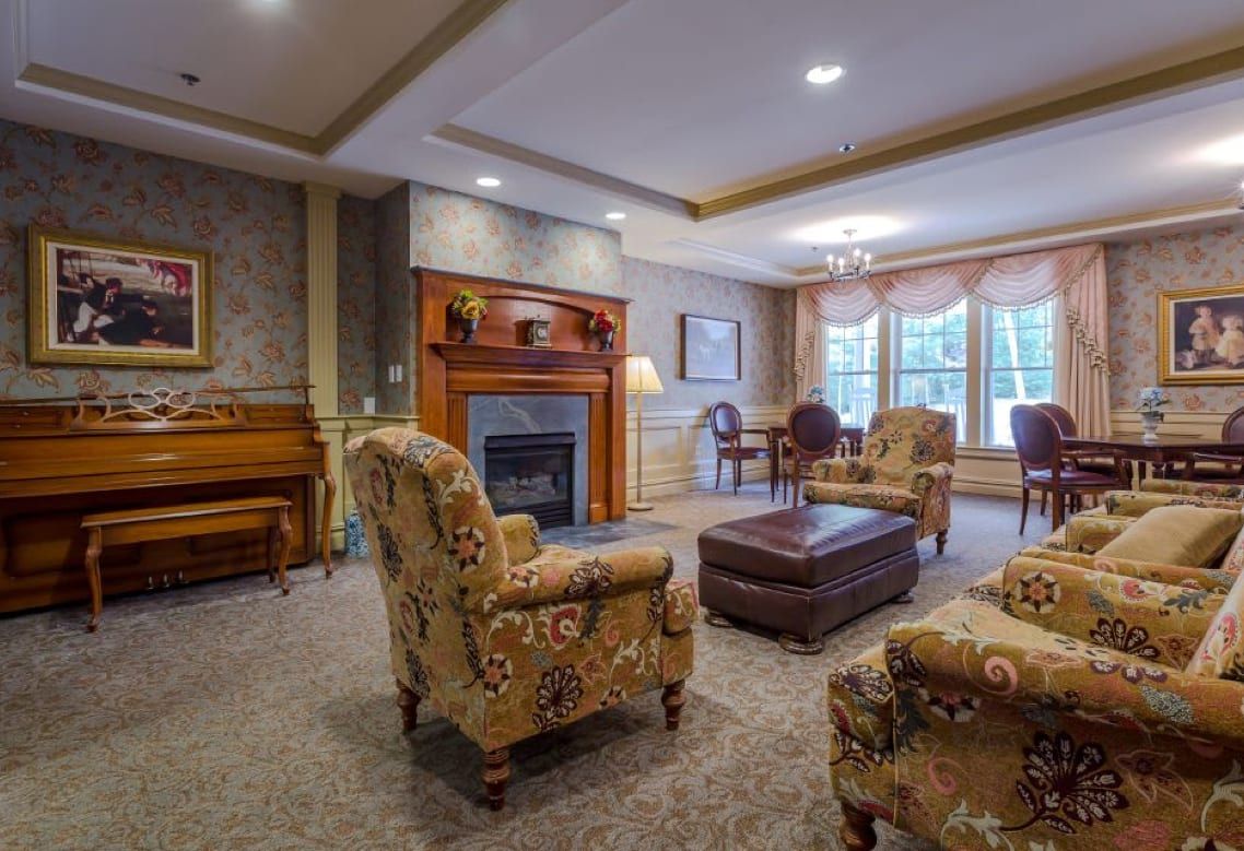 A cozy living room with comfortable seating and a warm fireplace.