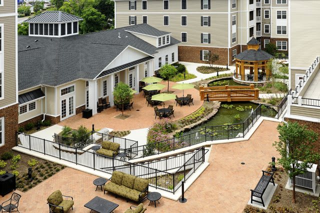 A well-maintained residential courtyard with outdoor seating and landscaped gardens.