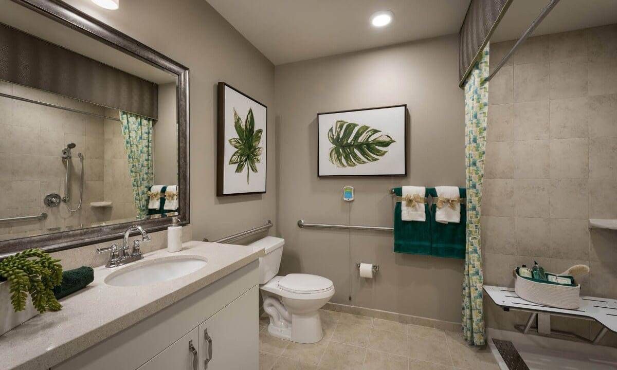 A modern bathroom featuring nature-themed wall art and elegant decor.