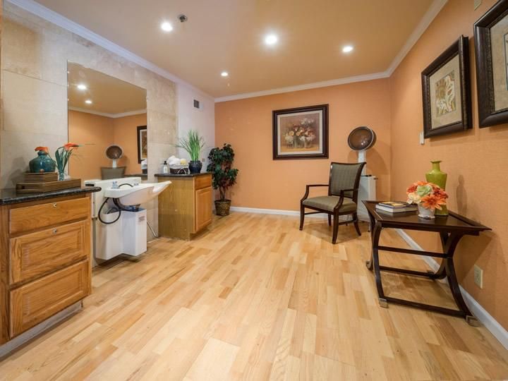 A serene spa room with cozy furnishings and warm lighting.