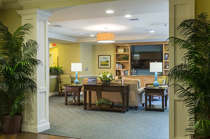 A cozy living room with comfortable seating and warm lighting.