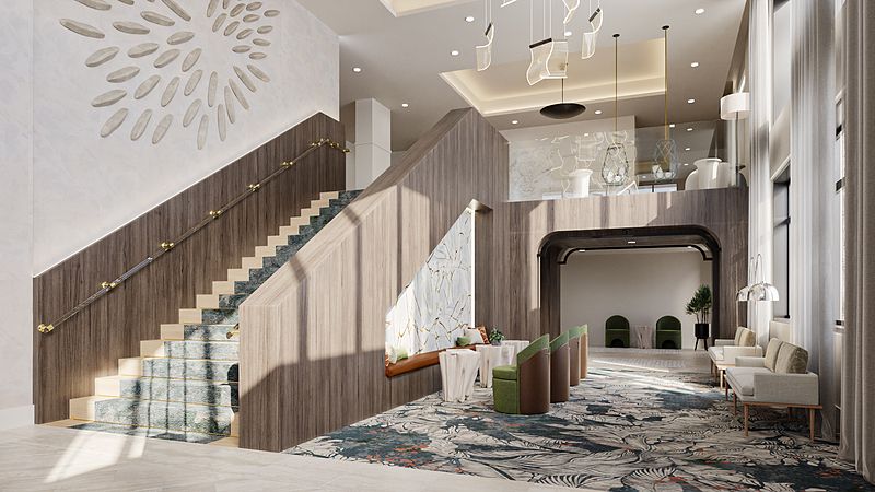 A spacious and modern lobby area with a stylish staircase and contemporary decor.