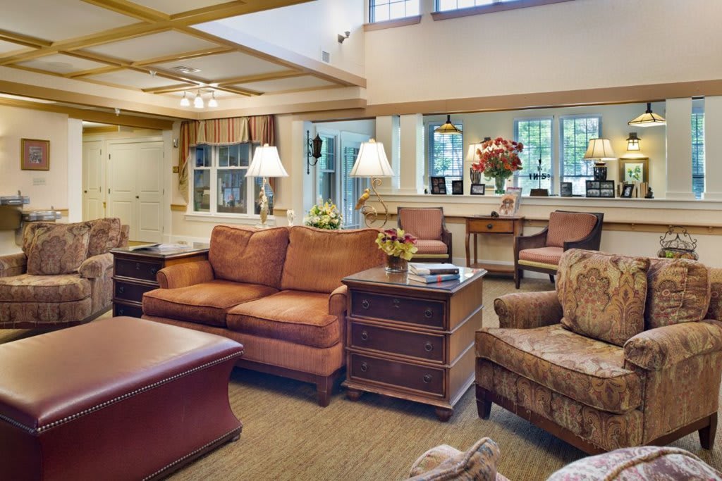 A cozy living room with comfortable sofas, warm lighting, and tasteful decor.
