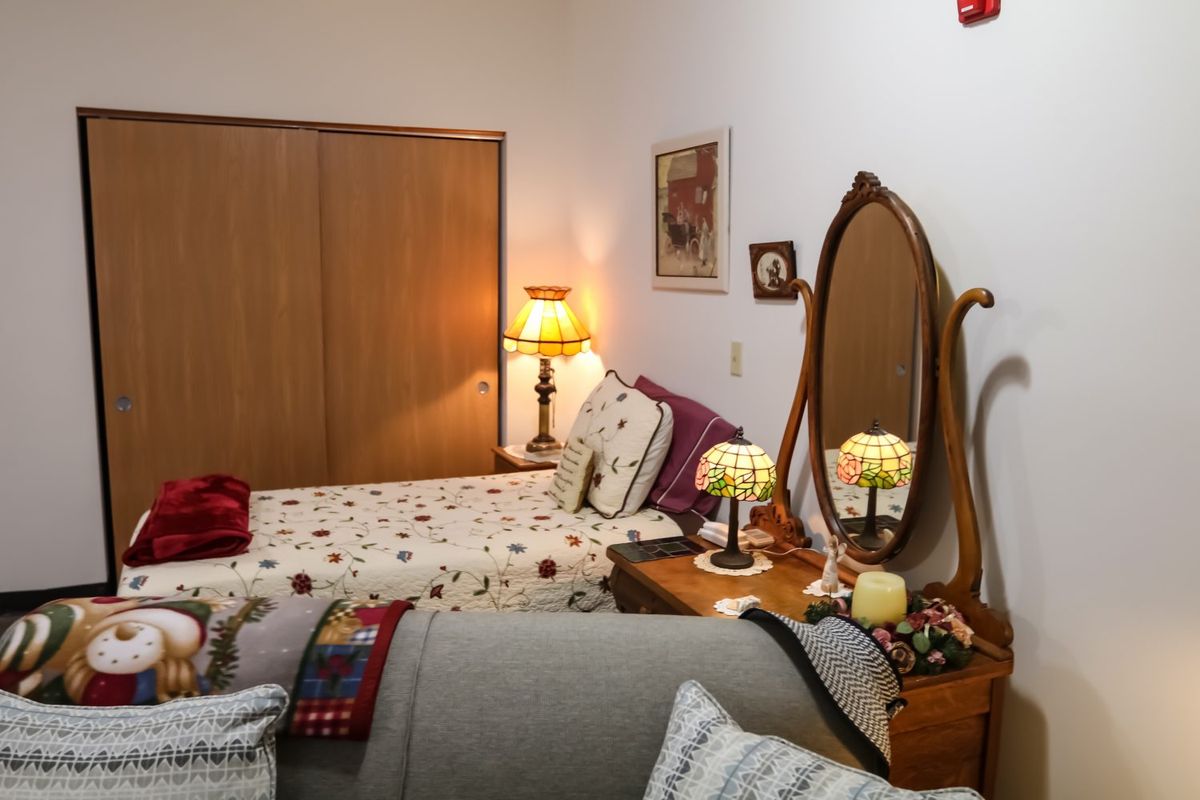 A cozy bedroom with vintage decor and a warm, inviting atmosphere.