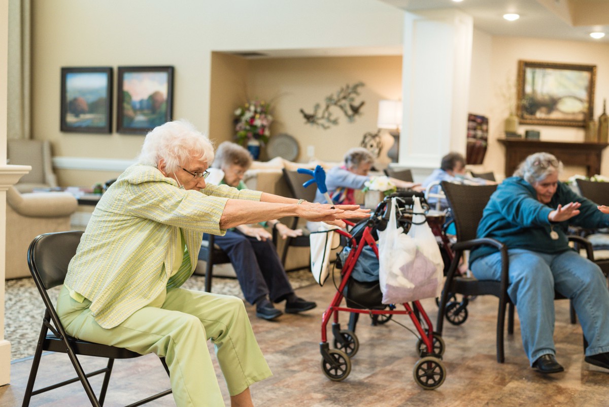 Seniors participating in a chair exercise class.