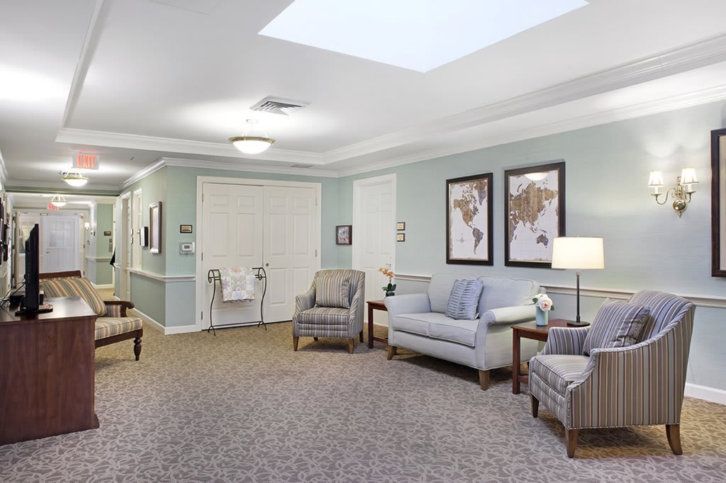 A cozy lounge area with comfortable seating and elegant decor.