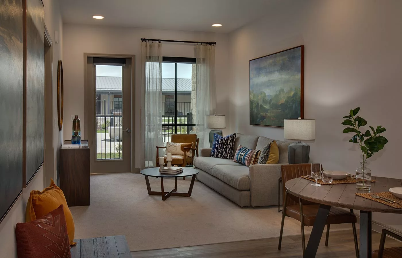 A modern and cozy living room with a large sofa, coffee table, and stylish decor.