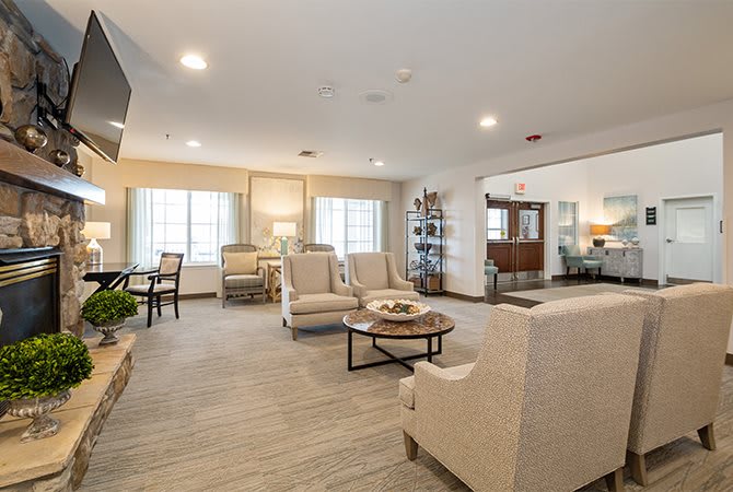 A spacious and modern living room with comfortable seating and neutral decor.