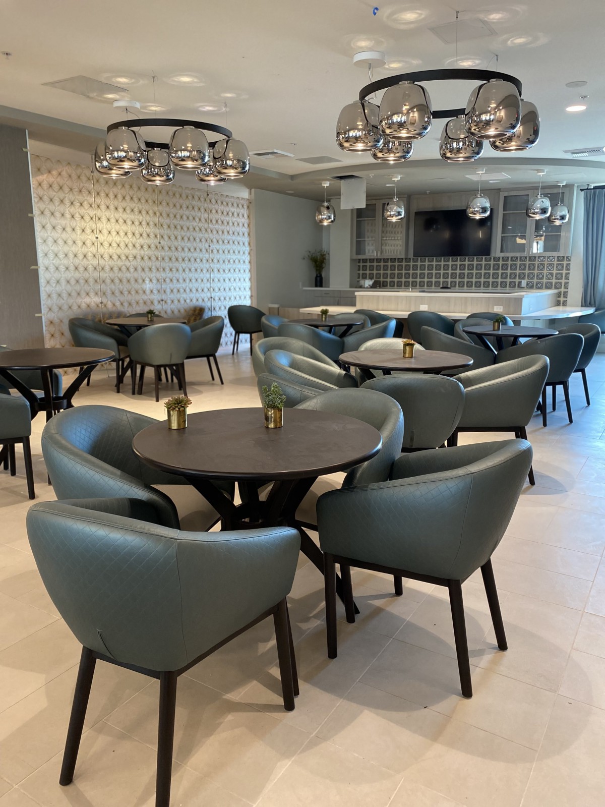 A modern dining area with stylish furniture and contemporary lighting.