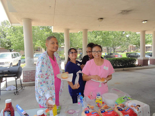 Participants enjoying a community event with food and smiles.