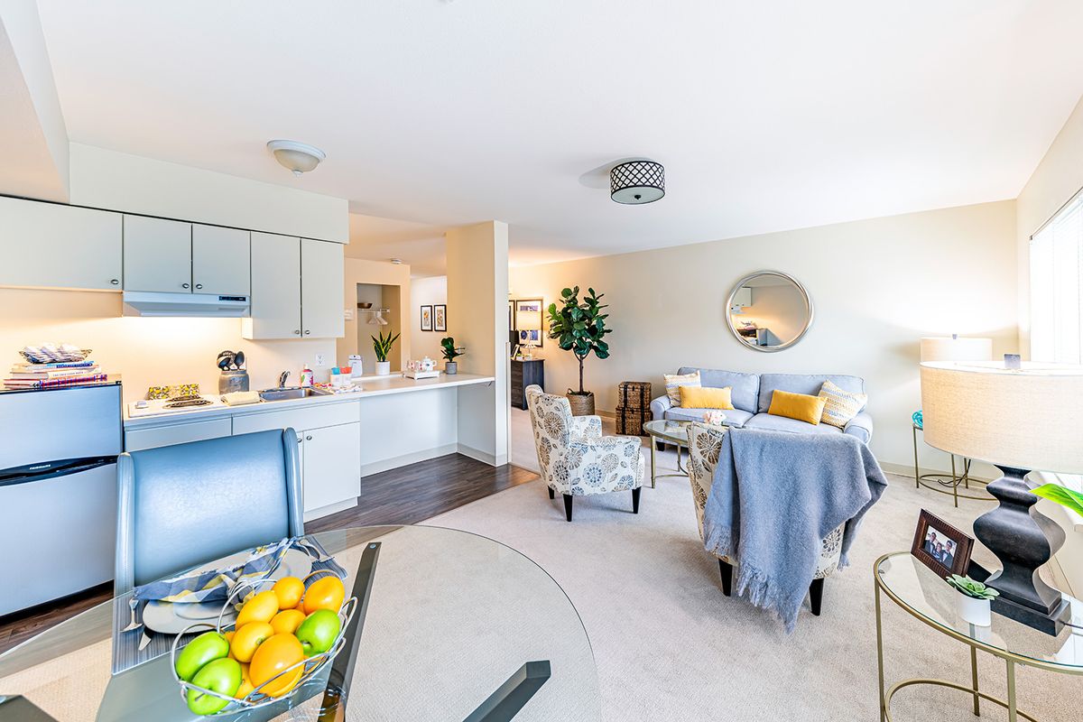 A modern open-concept living area featuring a bright and inviting interior with contemporary furniture and decor.