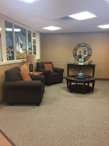 A cozy living room setup featuring comfortable seating and a stylish table.