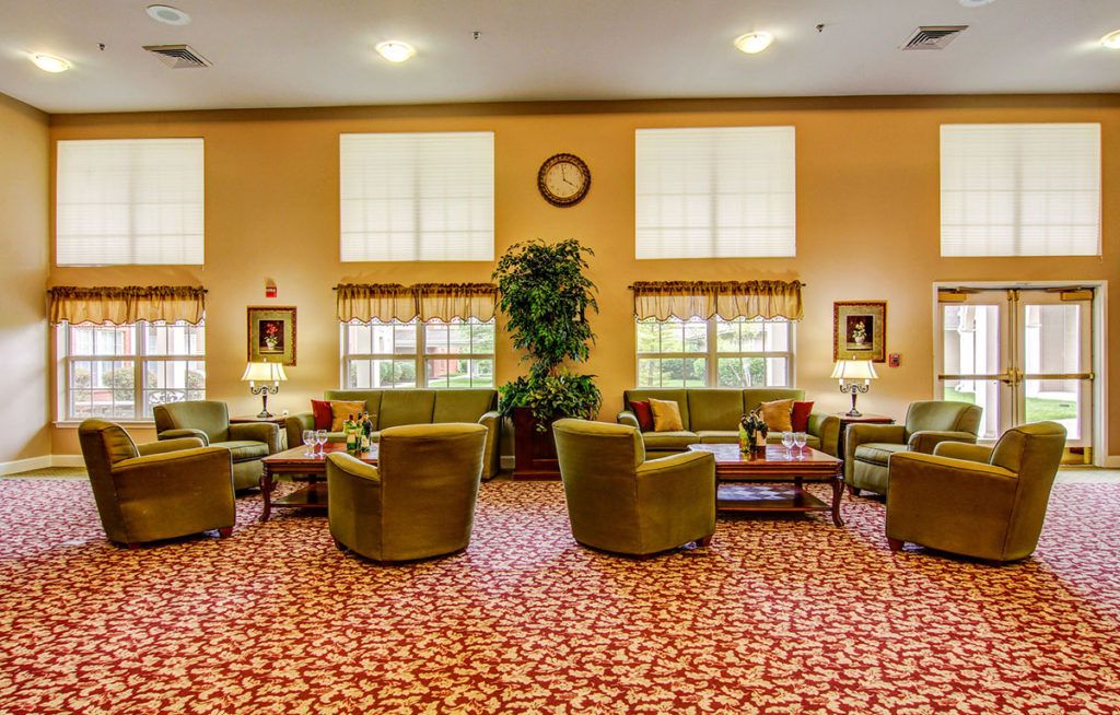 A cozy lobby area featuring comfortable seating and warm decor.