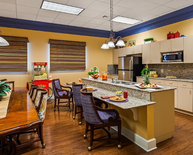 Modern kitchen and dining area with stylish furniture and decor.