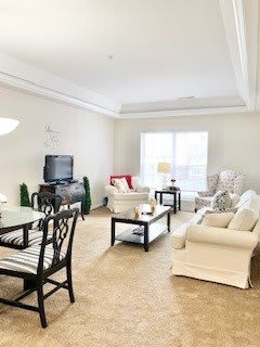 A bright and cozy living room with comfortable seating and modern decor.