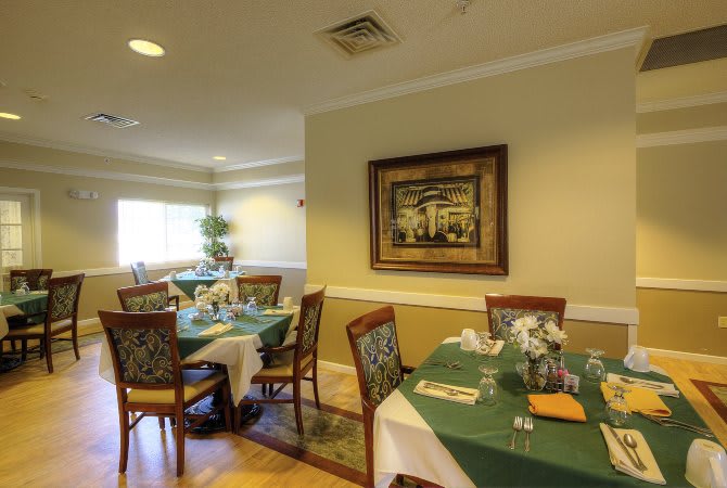 A cozy dining area with neatly arranged tables and chairs.