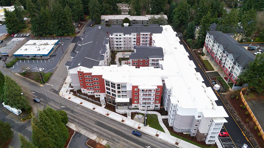 Aerial view of a modern residential building complex in an urban area.