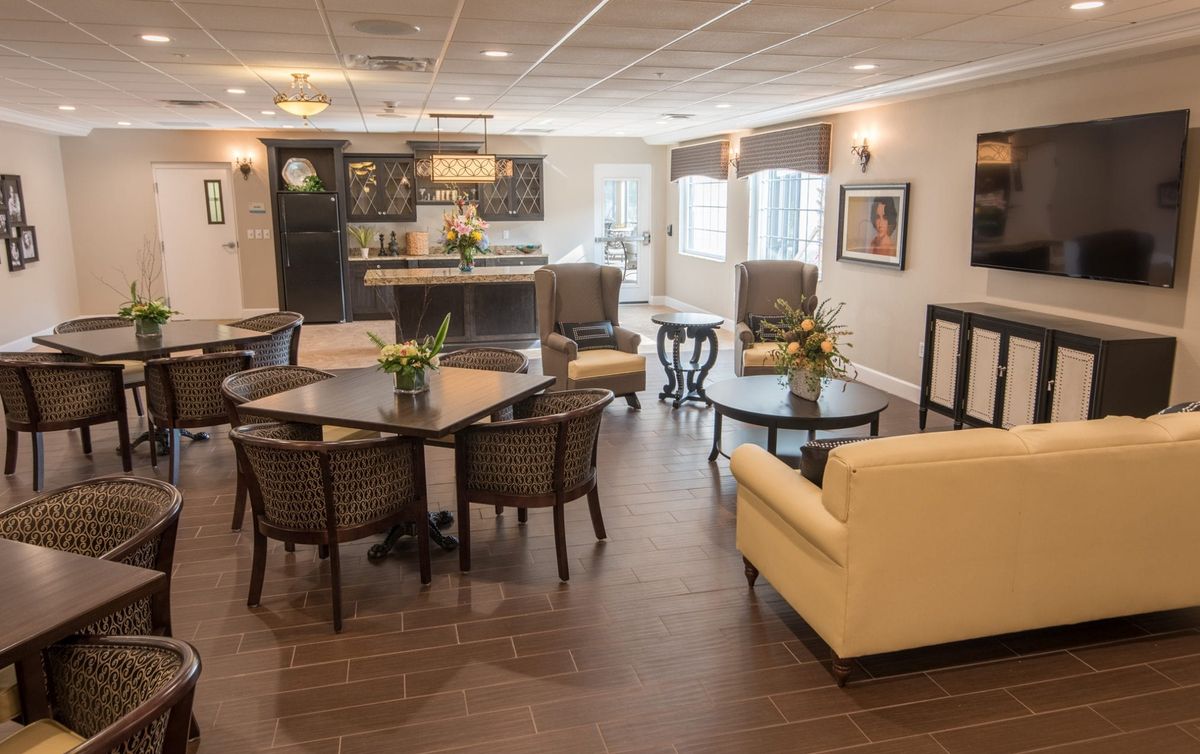 A modern living room with comfortable seating and elegant decor.