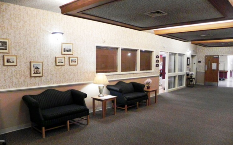 A cozy lobby area with seating and decorative lighting.