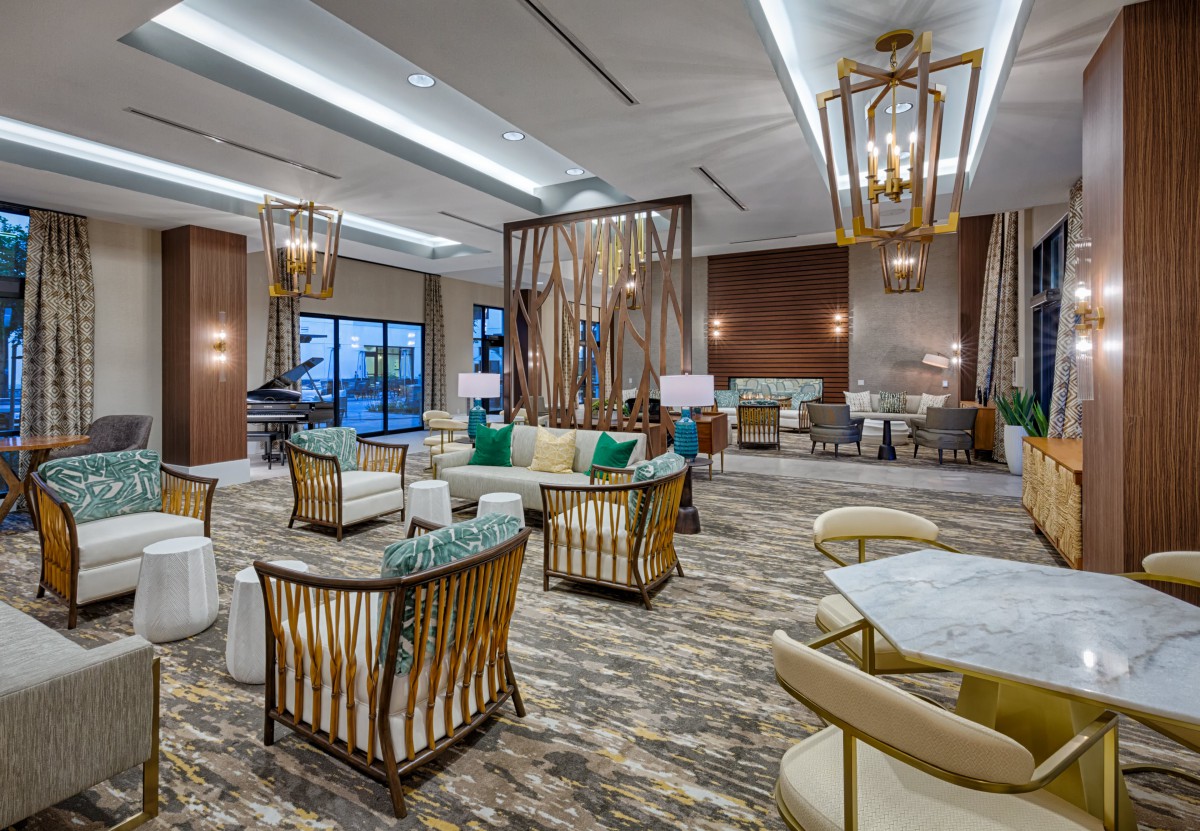 A luxurious and modern hotel lobby with elegant seating and lighting.