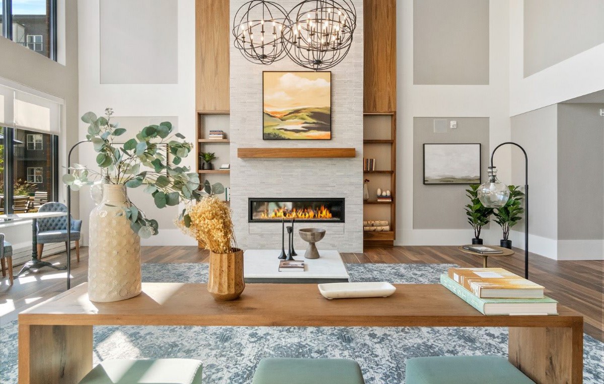 A modern living room with a central fireplace and stylish decor.