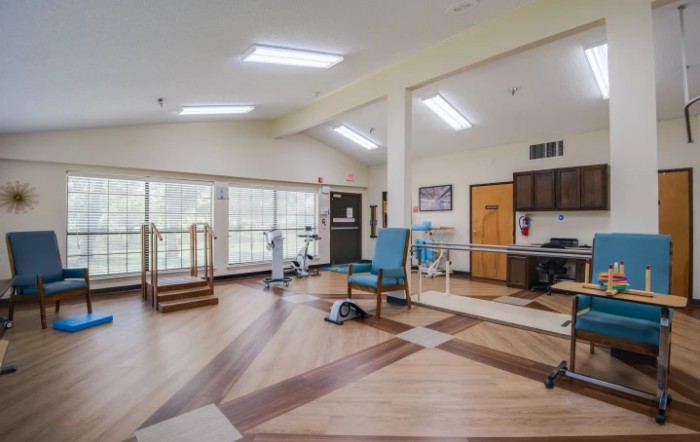 A spacious rehabilitation facility equipped with exercise and therapy equipment.