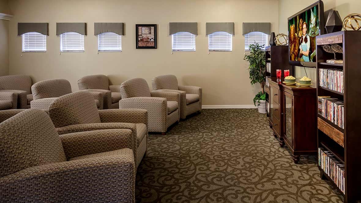 A cozy waiting room with comfortable chairs and decorative elements.