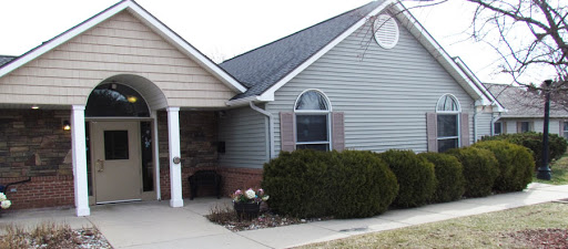 A charming single-story house with well-maintained landscaping.