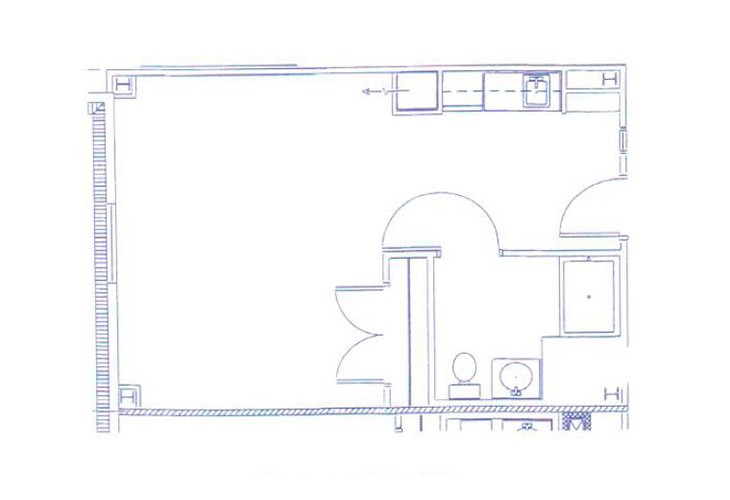 A blueprint layout of a residential or commercial space, displaying rooms and structural elements.