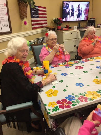 Seniors enjoying a vibrant craft activity together.