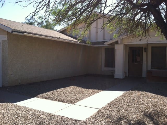 A suburban house with a simple front yard.