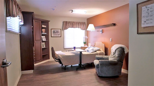 A cozy indoor room featuring a comfortable seating area, suitable for relaxation and reading.