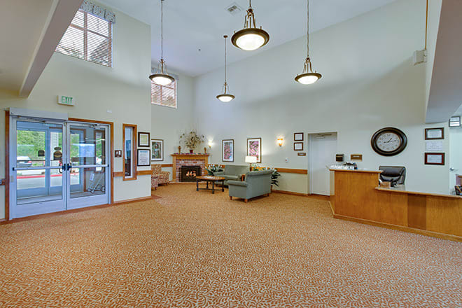 Spacious lobby area with comfortable seating and elegant lighting.